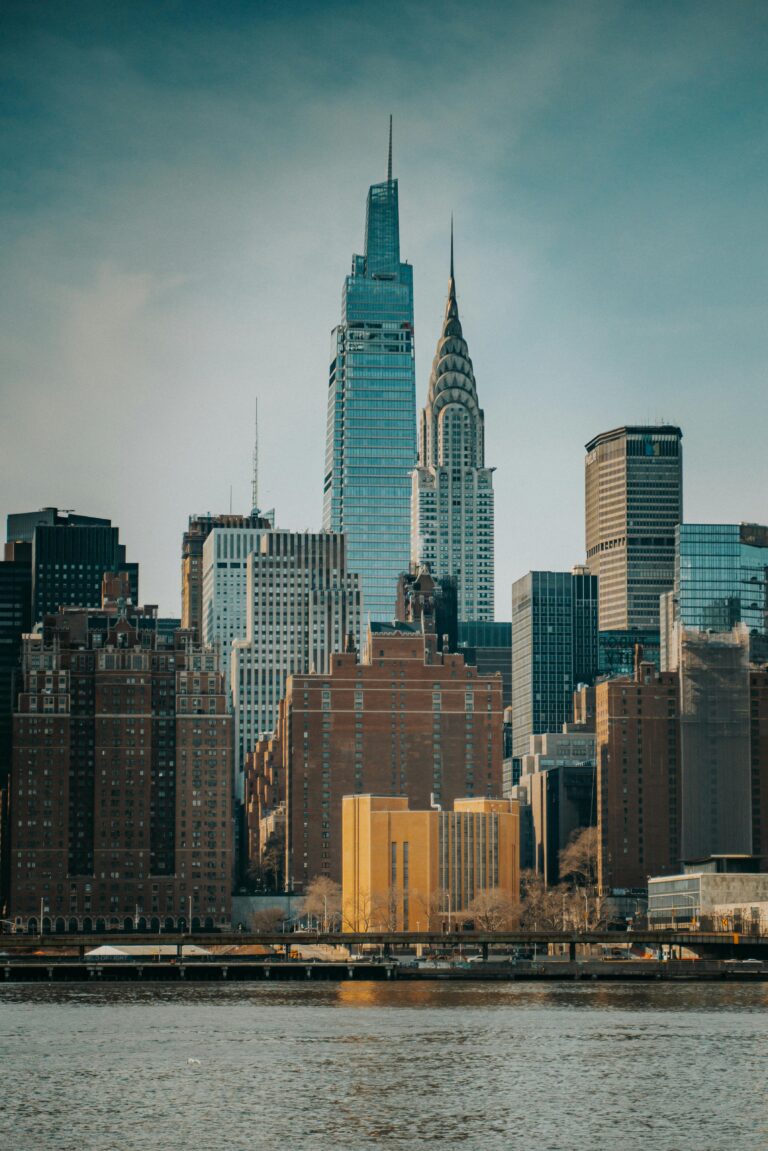 Captivating view of New York skyline with prominent Chrysler Building and waterfront.